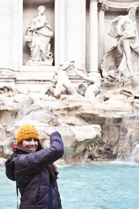 Throwing coins into the Trevi
