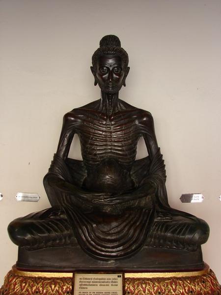An image of the Buddha sitting cross-legged in the attitude of subduing himself by fasting