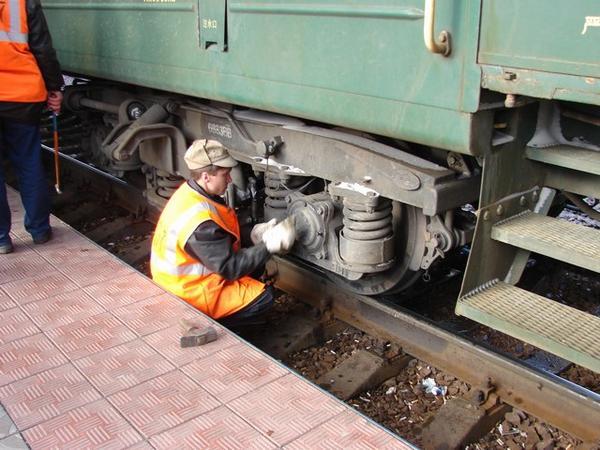 Guy fixing wheel with a common wrench