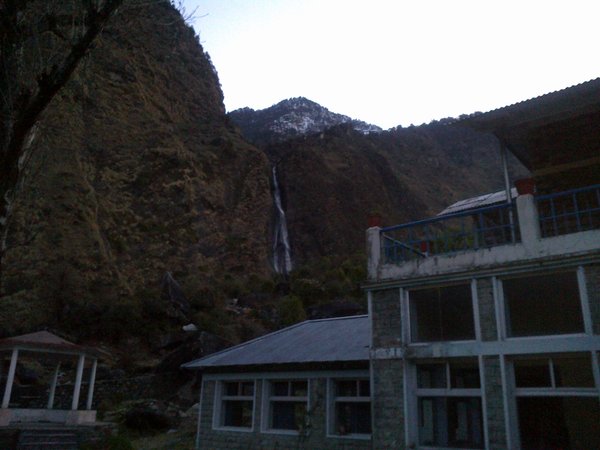 KMVN Guest House at Birthi with Birthi falls in the background.