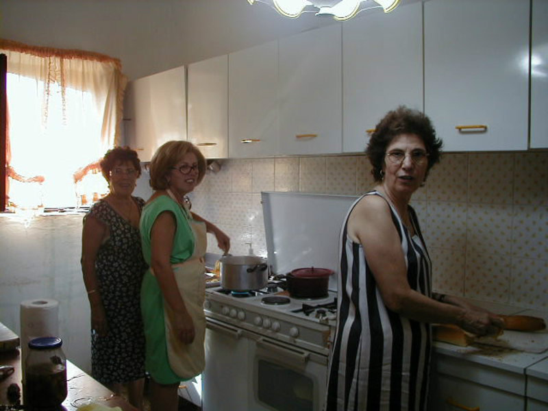 The ladies cooking in the farmhouse