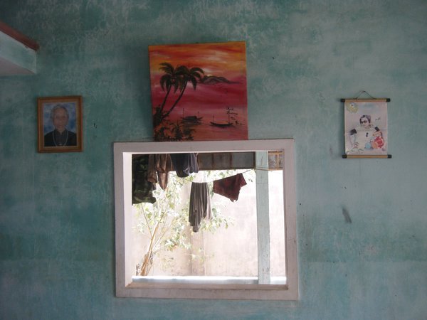 Mai's family is proud of his artwork which is displayed on the walls at thier house