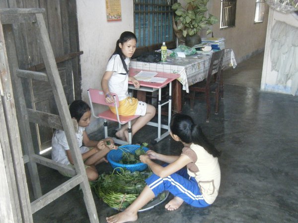 Ly's family members preparing food