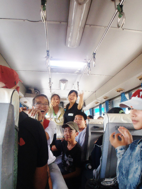 Students entertaining each other on the bus ride