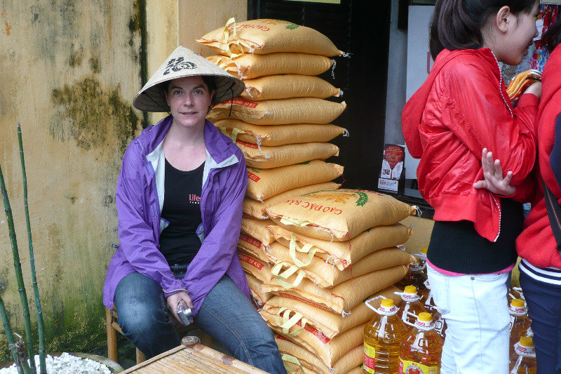 Volunteer Carmen - waiting to distribute rice to the poor