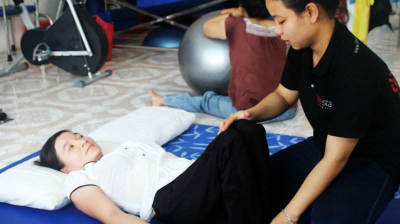 Physiotherapist Thuyet with Nhung