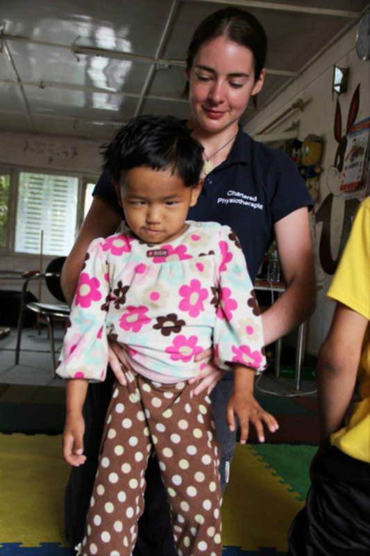  Standing and walking practice with children at the Special Education Rehabilitation Centre (SERC) school, Kathmandu, Nepal.