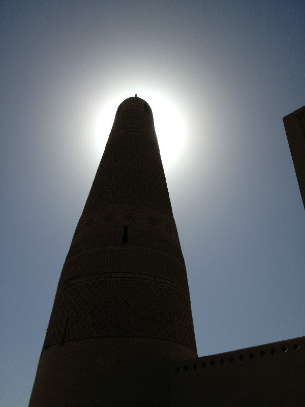 Minaret against the sun 