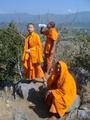 Meeting monks at the top of a hill