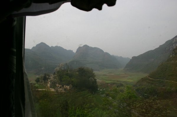 Hills and village from train, Guangzhou to Kunming