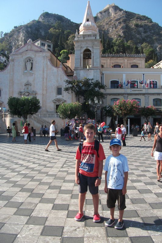 Typical Taormina piazza with street urchins