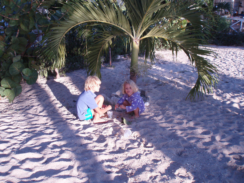 Samuel and Mia play on the beach