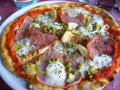 pizza with artichoke, cheese and ham