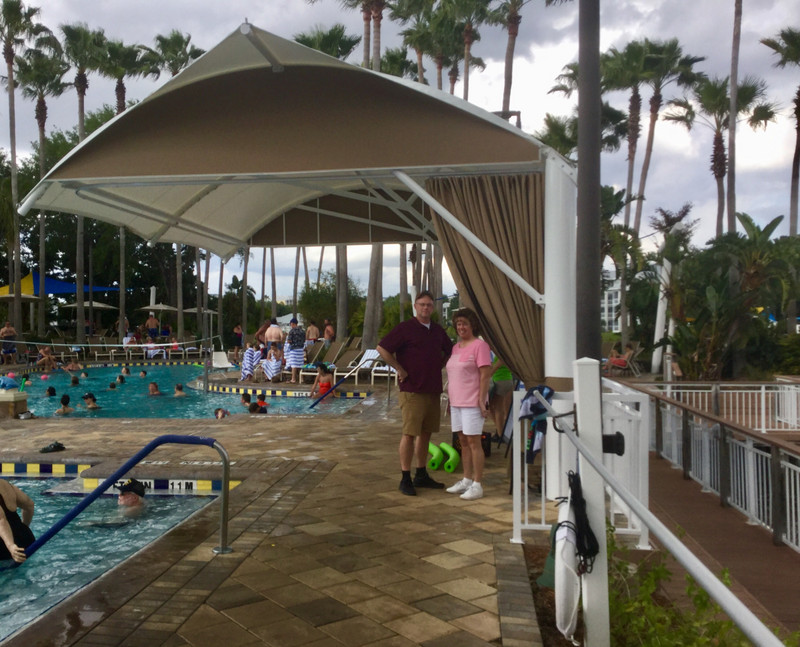 Cory & Lory at new awning at timeshare pool