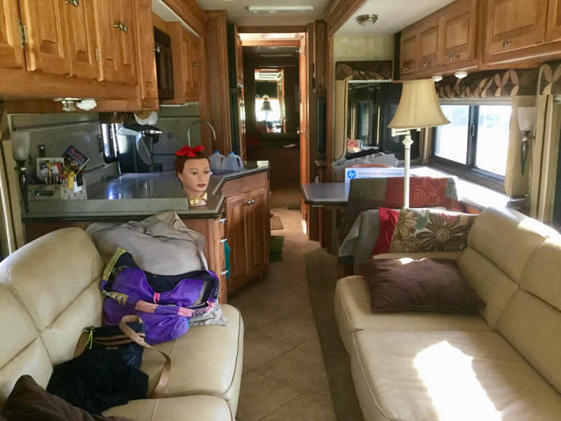 Inside the RV with slides in. Lulu watches everything 