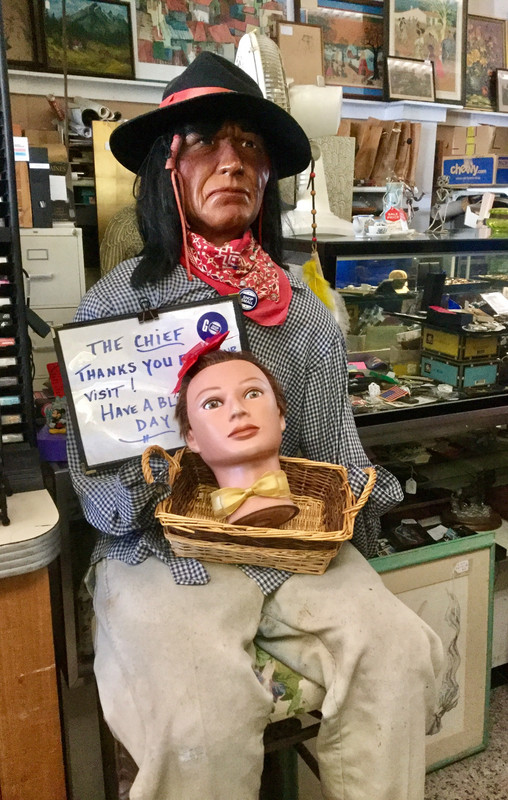 In an antique shop, Lulu cozies up to the Chief