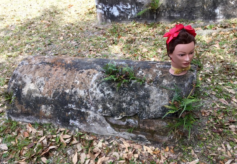 Lulu on casket shaped gravestone