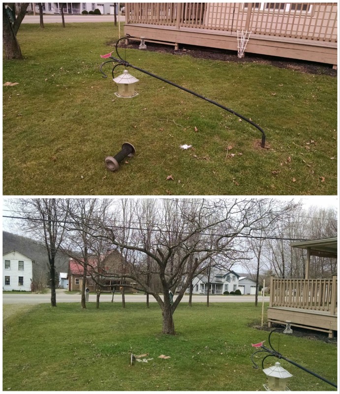 Broken, bent bird feeders and pole