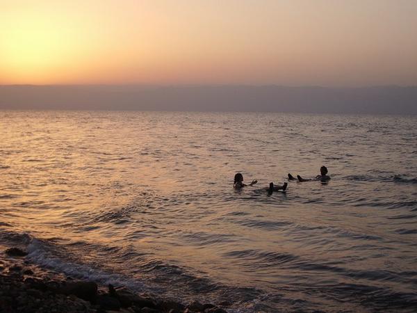 Swimming in the Dead Sea at Sunset