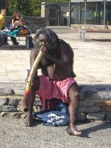 Aboriginal playing the didgeridoo