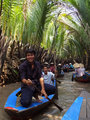 Views of the narrow canal row boat cruise in the Mekong Delta