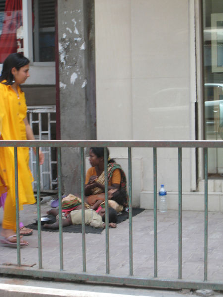 Begging Beside Amputee Child