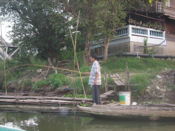 Thai Man fishing the river
