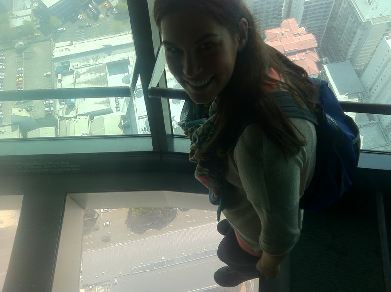 Kayleigh on the glass floor of the Sky tower in Auckland