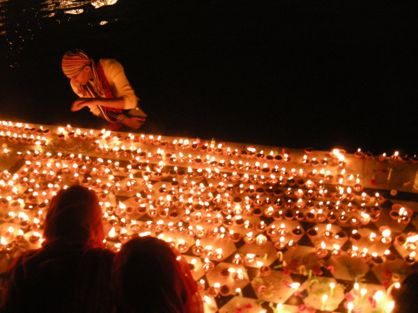 Lighting candles for diwali
