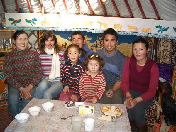 Mongolian family with two foreign guests
