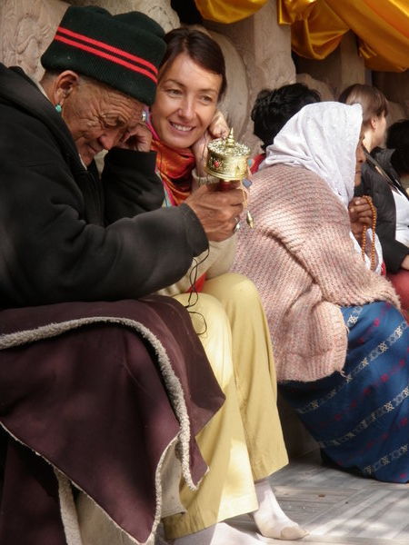 Foreigner Sharing Earbuds with Old Tibetan Man