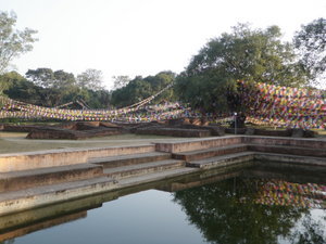 10s of Thousands of Prayer Flags behind Pond