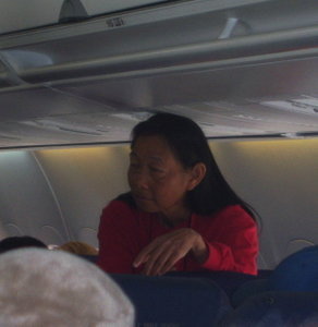 Susan on the airplane going to Kauai'i
