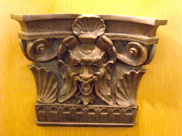 carving on stair well wall