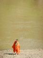 young monk by river