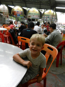Sam waits for his dinner at a hawker center