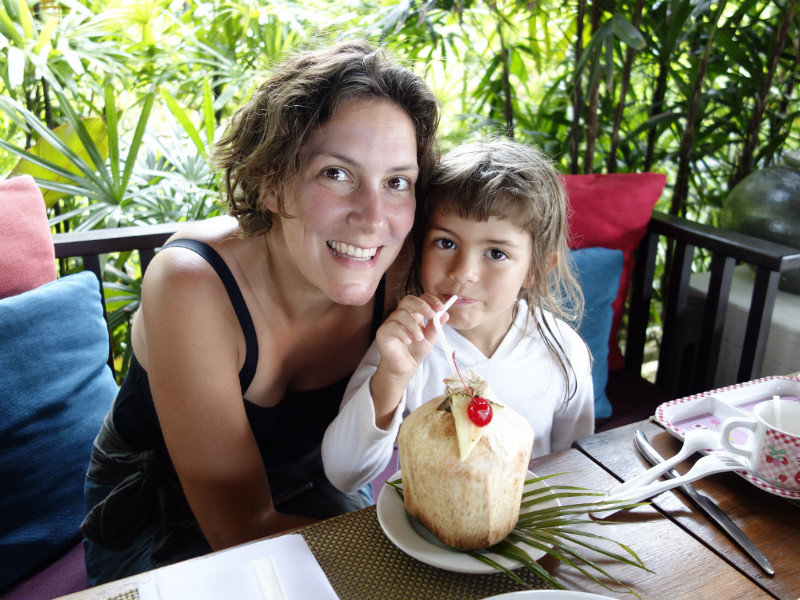 Lea & Mimi sharing fresh coconut juice - by PK