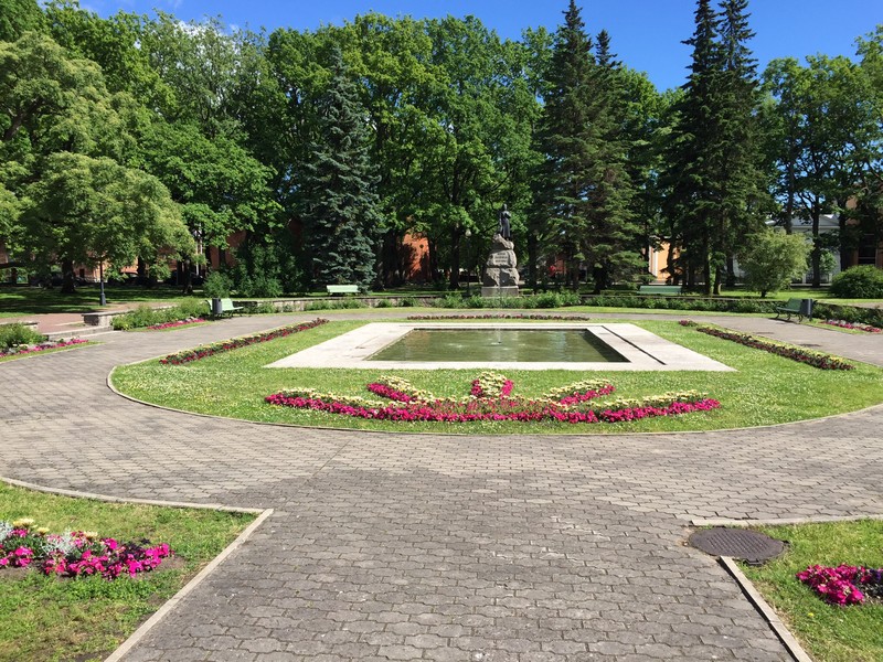 Statue in park to poet, again lots of flowers