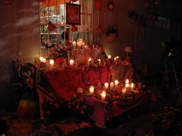 A family's ofrenda on the street.