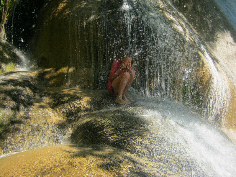 Hiding under a waterfall