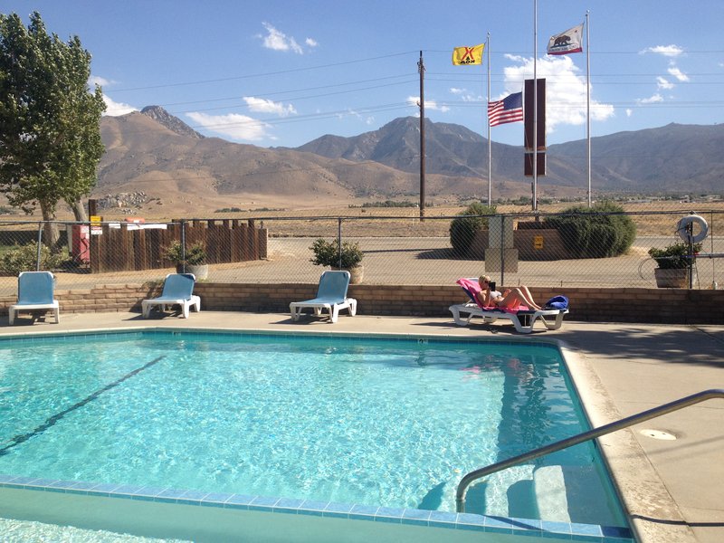 After a long day, a cool drink by the pool with great view at Lake Isabella KOA