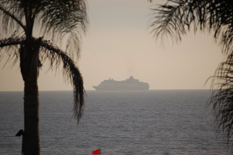 A passing cruise ship in the sea mist