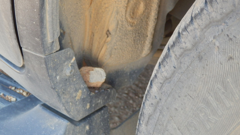 A stone just sitting there in the wheel well.