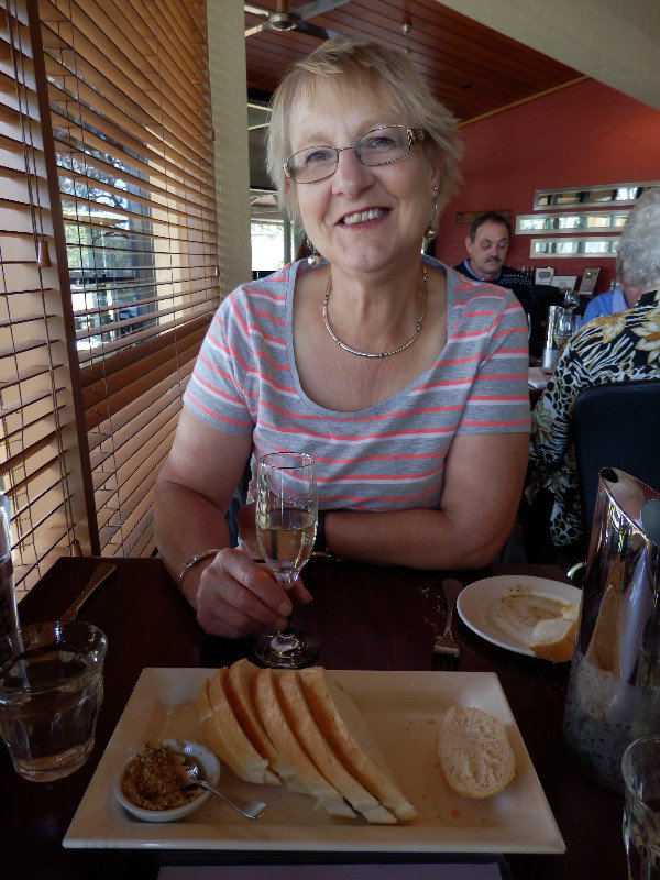 Joan is ready for lunch with a glass of bubbles!