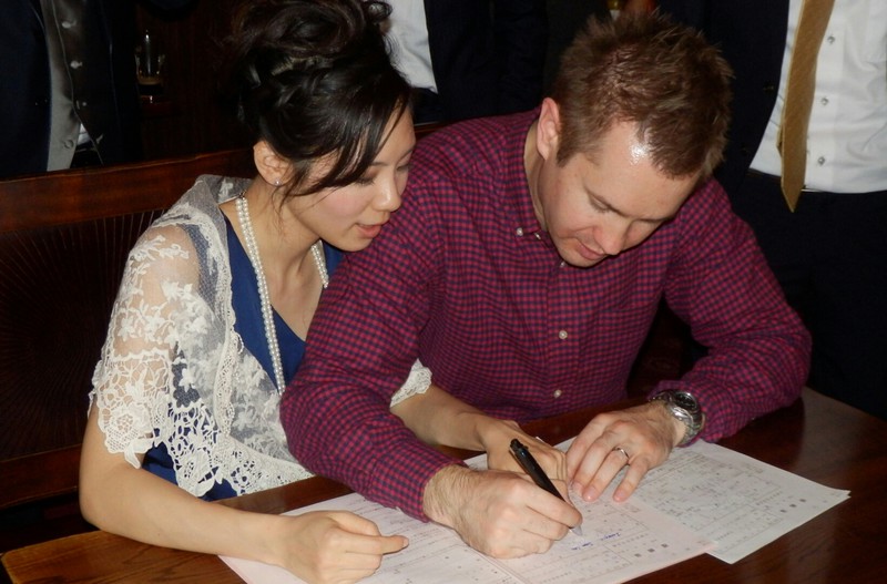 How cute. Signing the marriage forms.