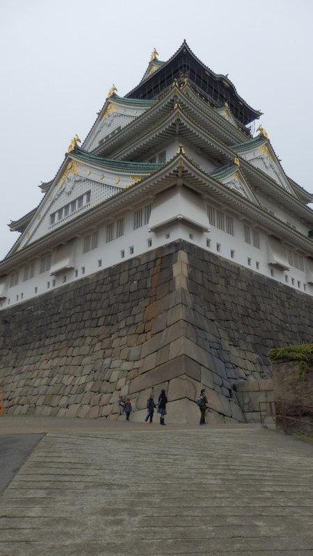 Osaka castle towers above yet another set of imposing walls.