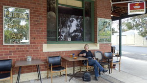 Joan enjoying a cold drink under the verandah of the country pub in Murrayville.