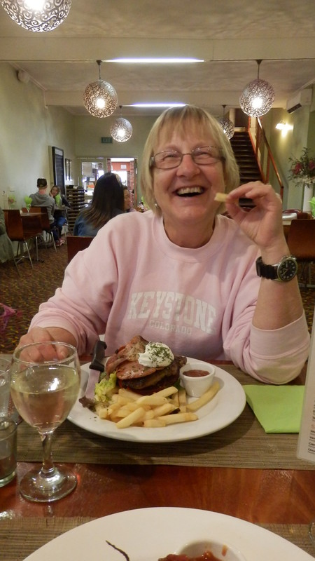 Joan enjoying her open steak sandwich