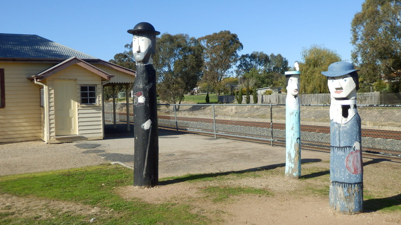 Fascinating wooden figures next to the old Glenrowan railway station