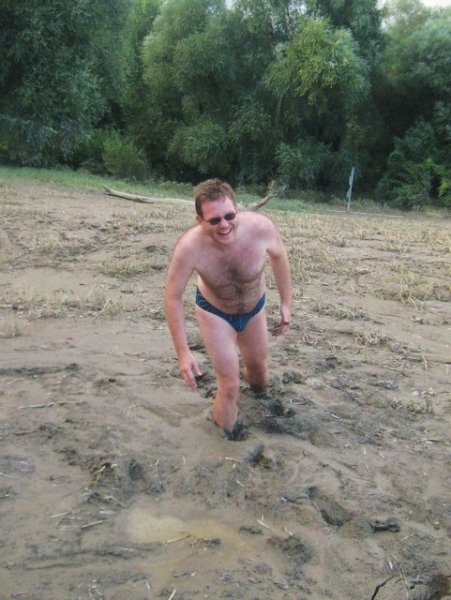 Nils knee deep in mud
